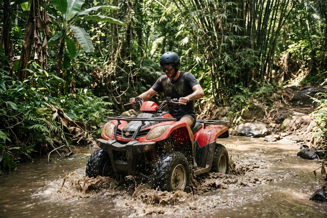 A quad bike crossing a shallow jungle stream